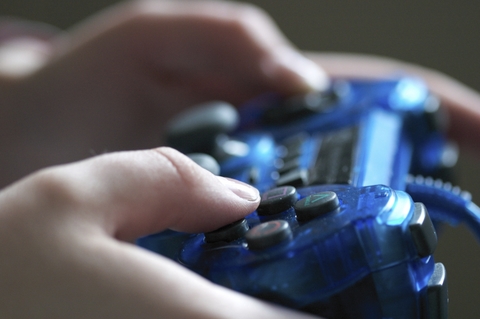 A child holding a video game controller
