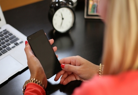 Person putting finger on cellphone