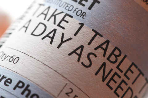 Close-up photo of prescription pill bottle and label