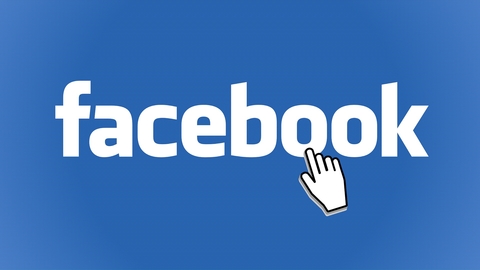 Small white hand pointing to the word 'Facebook'