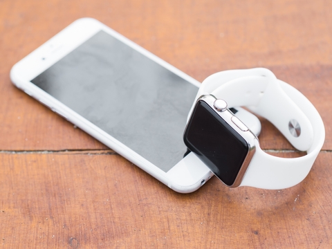 Photo of an iPhone and an Apple Watch