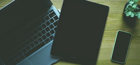 Laptop computer and tablet computer on table