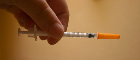 Injection A syringe held in two hands