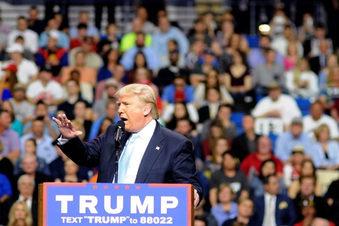 Donald Trump Donald Trump speaks at a lectern