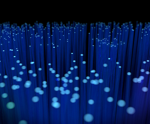 Fiber optics glowing blue rods with a dark background