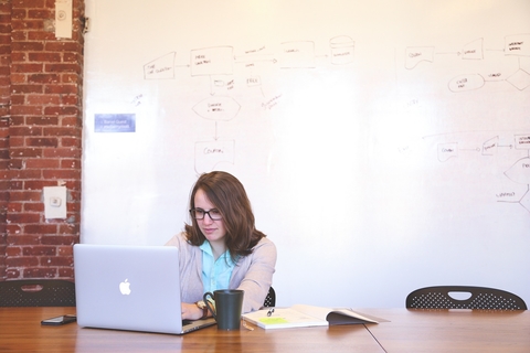 Millennial Young woman using computer