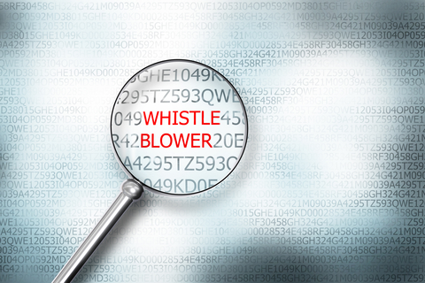 Whistleblower magnifying glass (CREDIT: Getty/Imilian) magnifying glass over word "whistleblower"
