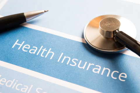 Health insurance, pen and stethoscope 