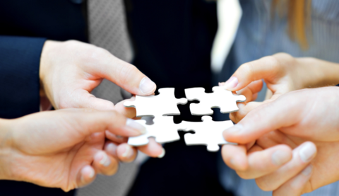 Puzzle pieces merger acquisition (iStockPhoto) iStockPhoto.com