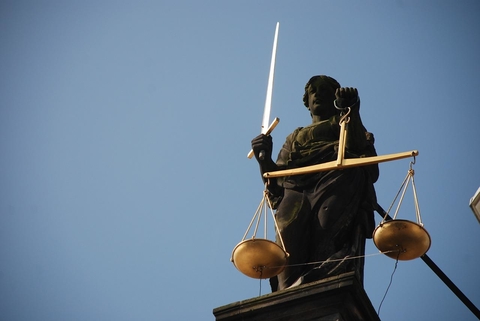 Justice statue with sword and scales