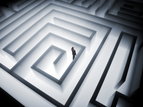 Man in a Maze CREDIT: Getty/Stewart Sutton A man trying to find his way through a maze