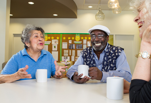 Oak Street patients (Credit: Oak Street Health) Oak Street patients sit at table