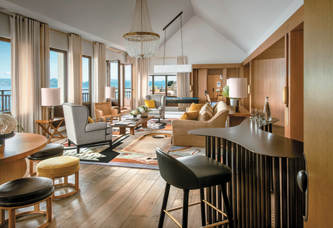 The Royal Suite The Royal Suite has a large living room with a sitting area and a pool table, dining table for six and a separate bar.