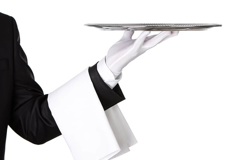 Waiter holding silver platter - Nastco/iStock/Getty Images Plus/Getty Images Waiter holding silver platter - Nastco/iStock/Getty Images Plus/Getty Images