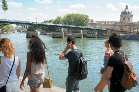 U by Uniworld Editorial Young travelers walk along the Seine River in Paris