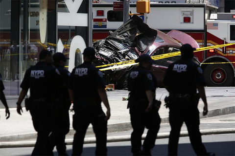 Times Square Crash Newscred A smashed car sits on the corner of Broadway and 45th Street in New York's Times Square after ploughing through a crowd of pedestrians at lunchtime.