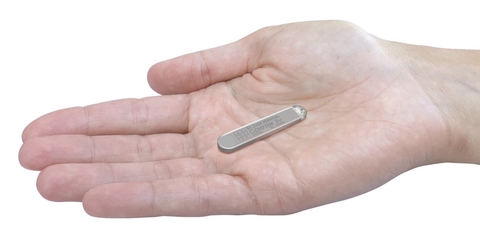 confirmRx - Abbott confirmRx inersertable cardiac monitor in a hand - Abbott