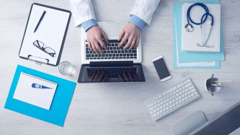 Doctor's hands with computer and gadgets - CORRECTED - 800 px Doctor with computer and gadgets
