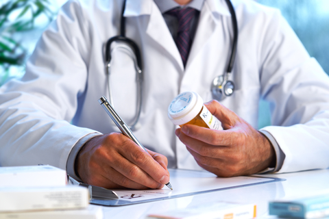 Doctor writing prescription pharmacist drugs opioids RX CREDIT: Getty/18percentgrey A coctor writing a prescription