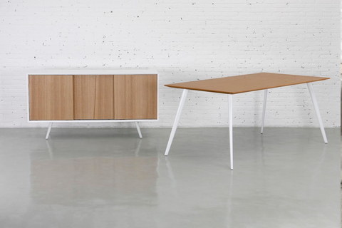 Airfoil sideboard The casegood has formed steel tube legs and a wooden face, mixing materials for a contemporary yet classic look.