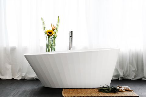 Couture tub The bathtub collection, designed by Patrick Messier, has a design that follows a fluted shape and draws inspiration from the ebb and flow of the ocean.
