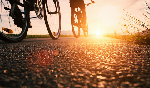 Bikes Getty Bike wheels close up image on asphalt sunset road