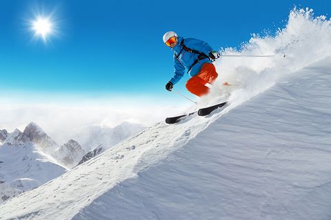 man skiing // Photo by Jag_cz/iStock/Getty Images Plus/Getty Images man skiing downhill