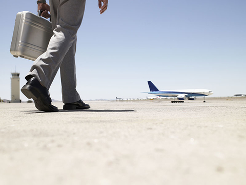 Businessman Walking Toward Airplane Businessman Walking Toward Airplane