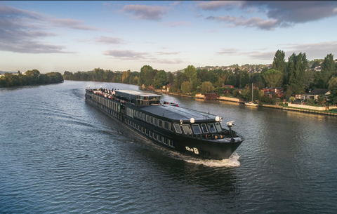 The B - U by Uniworld U by Uniworld's ship The B as it sails along the Seine