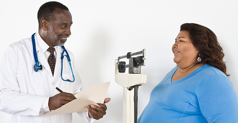 Doctor with patient who is obese