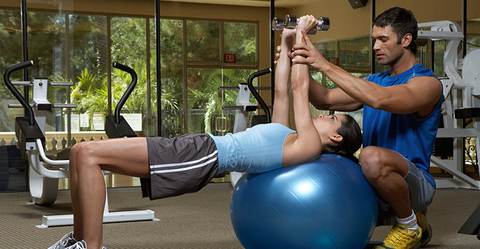 Personal trainer with client.