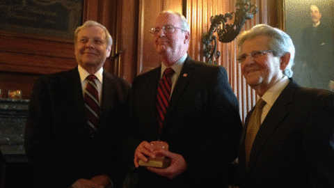 Jack Lund president and CEO of the YMCA of Greater New York middle receives the 2014 Outstanding AssociationNonprofit Executive Award from Carter Keithley left a member of the New York Society of Association Executives NYSAE Board of Directors and Joel A Dolci president and CEO of the NYSAE Photo courtesy of the YMCA of Greater New York