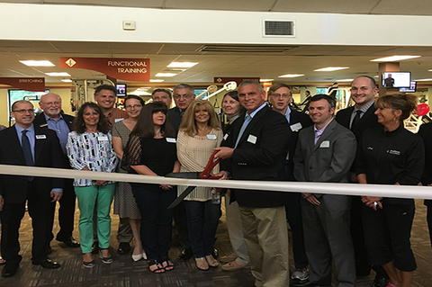 Healthtrax Fitness amp Wellness CEO Steve Capezzone center with scissors and colleagues cut the ribbon for the company39s renovated Newington Connecticut location Photo courtesy Healthtrax