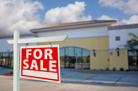 For sale sign For sale sign in front of a business