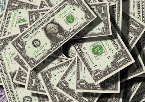 Pile of dollar bills Dollar bills in a pile