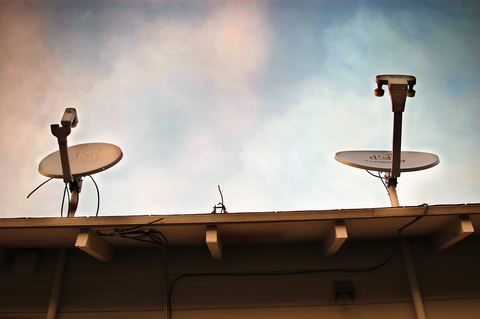 Dish Network dishes satellite dishes on a roof