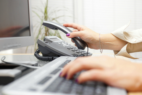 Internet and voice Woman is picking up the headset from phone, assistance concept