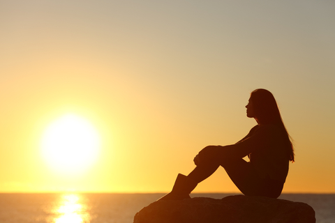 girl looking at sunset girl looking at sunset