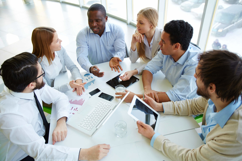 Millennial workers Millennial workers at a table