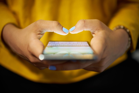 Social media / texting Woman using her smartphone