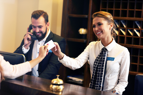 Smiling front-desk employees Smiling front-desk employees