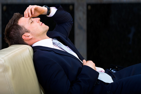 Tired/Sleeping Businessman - nyul/iStock/Getty Images Plus/Getty Images