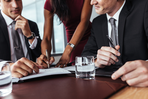 Businesspeople having a meeting in office Businesspeople having a meeting in office
