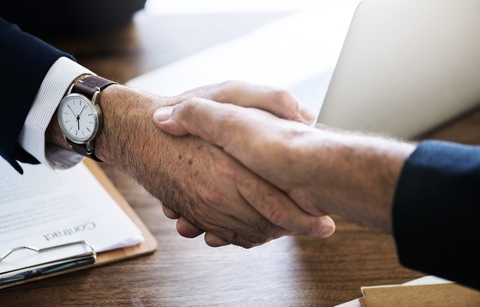 Handshake business deal executives Handshake business deal executives