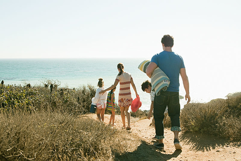 Summer Vacation Getty Family walking to the beach