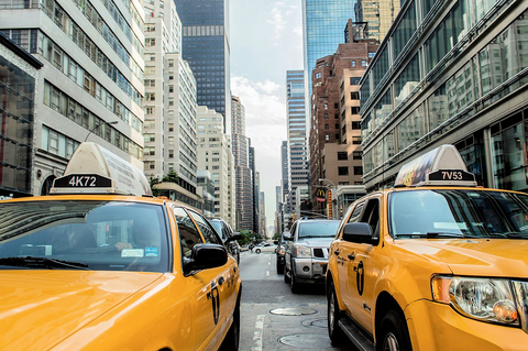 Taxis on city street Yellow cabs