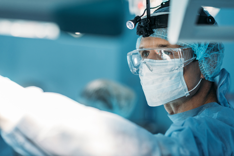 Surgeon with mask and glasses Surgeon with mask and glasses