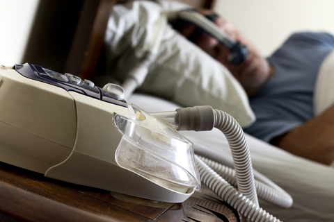 CPAP sleep apnea machine CPAP sleep apnea machine with sleeping patient