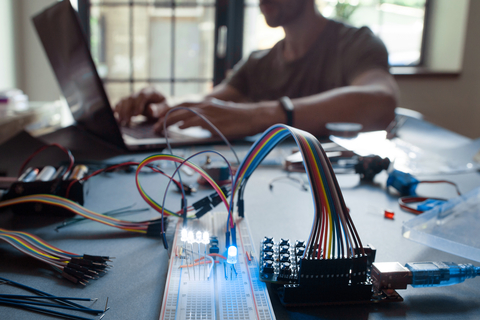 Electronic lab engineer on laptop Electronic lab engineer on laptop