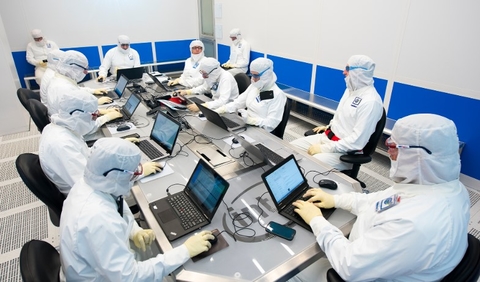 intel clean room guys in clean room gear on laptops
